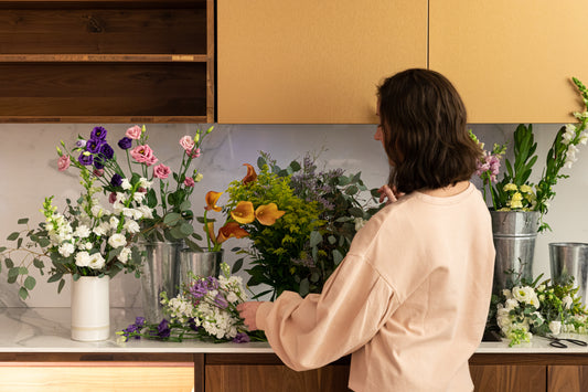 Woman treating her flowers